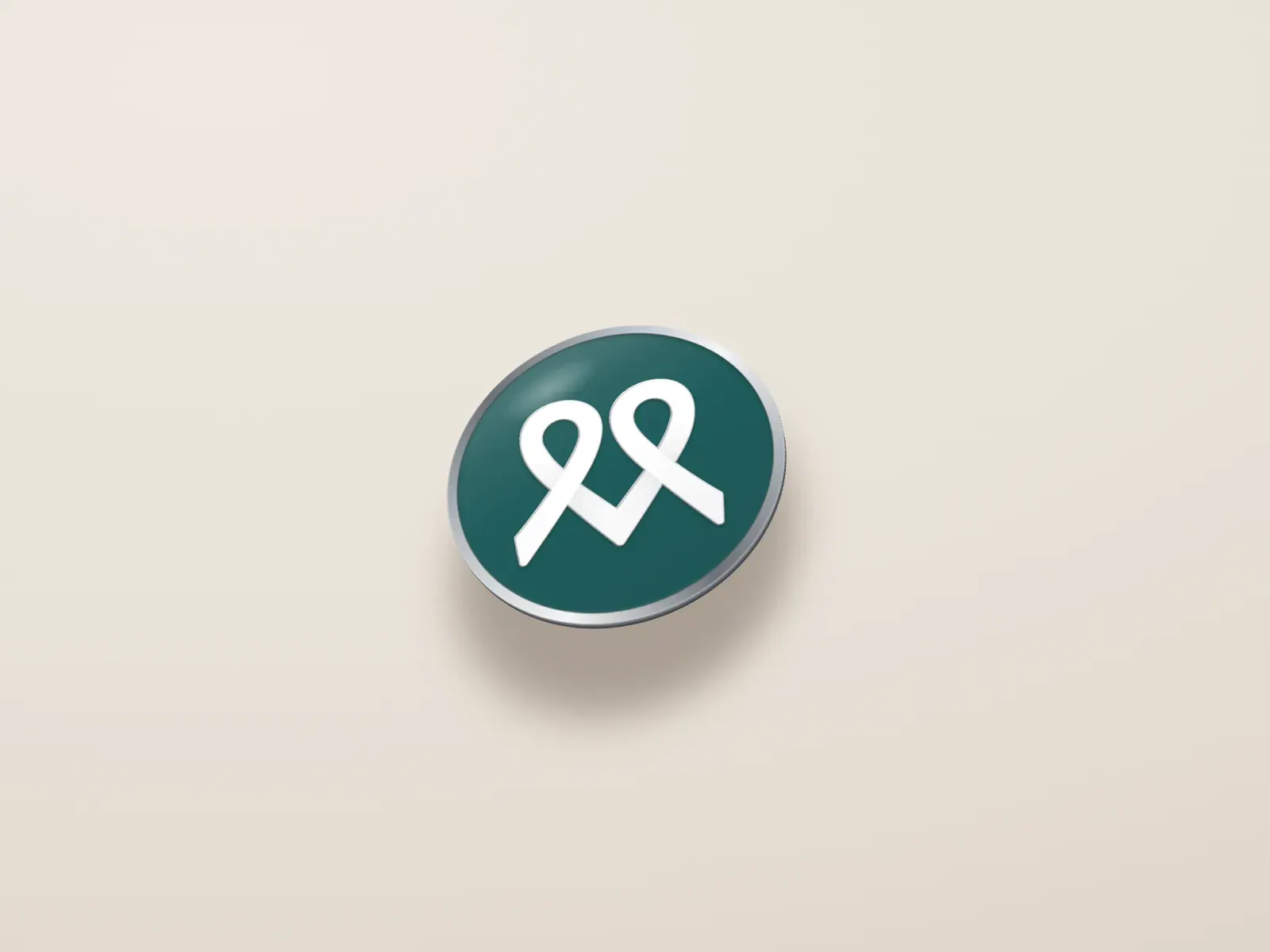An enamel lapel pin with the white ribbon mark on teal